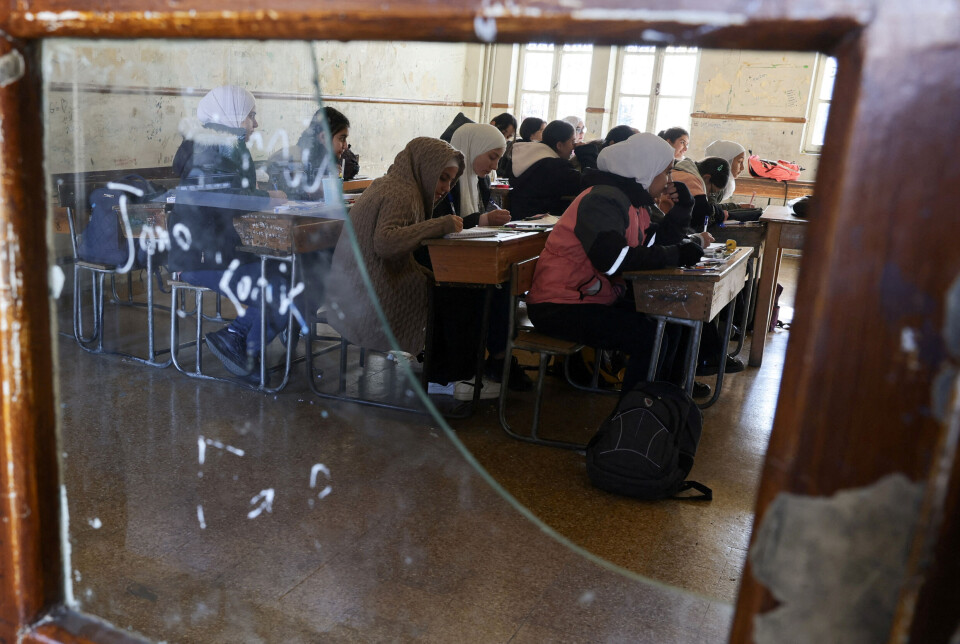Studenter vender tilbake til sineundervisningsrom på universitetet etter at Assad flyktet.