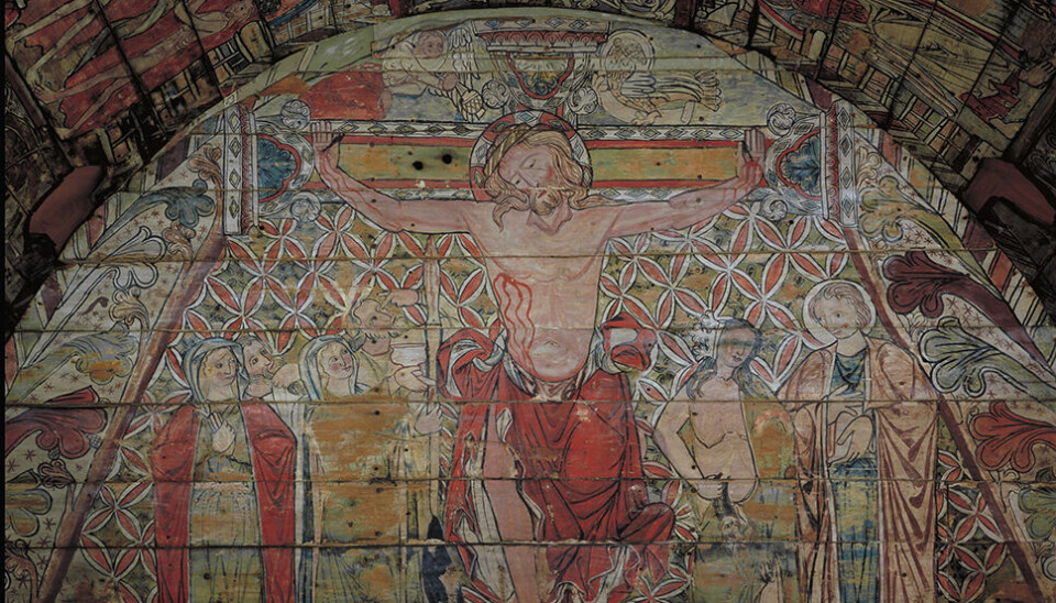 KRISTENDOM VERSUS JØDEDOM: I korsfestelsesscenen i taket til Ål stavkirke er kristendommen og jødedommen personifisert som to kvinner, Ecclesia og Synagoga. Synagoga er halvnaken og holder et geitehode. Ecclesia på sin side, er anstendig kledd og i hånden holder hun en vinkalk. Taket i Ål Stavkirke